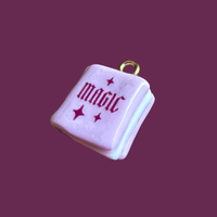 Pink magic book charm
