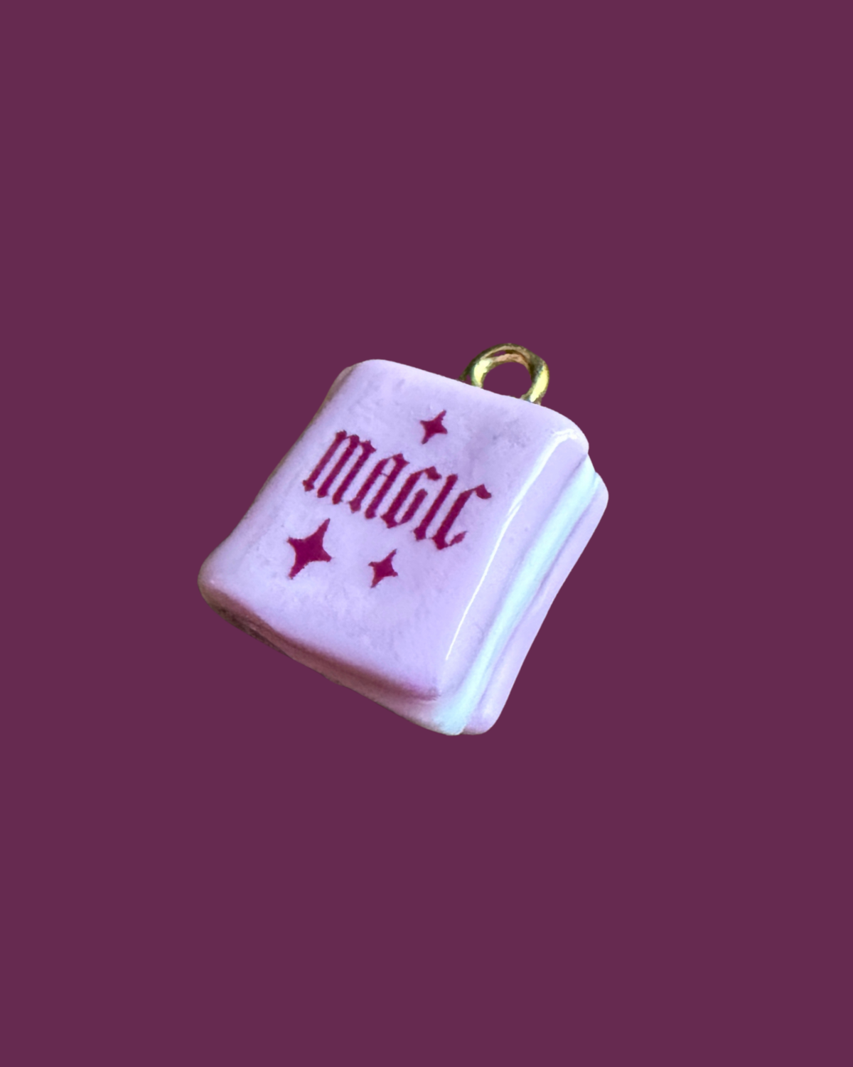 Pink magic book charm