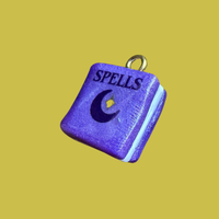 Purple spell book charm