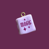 Pink magic book charm