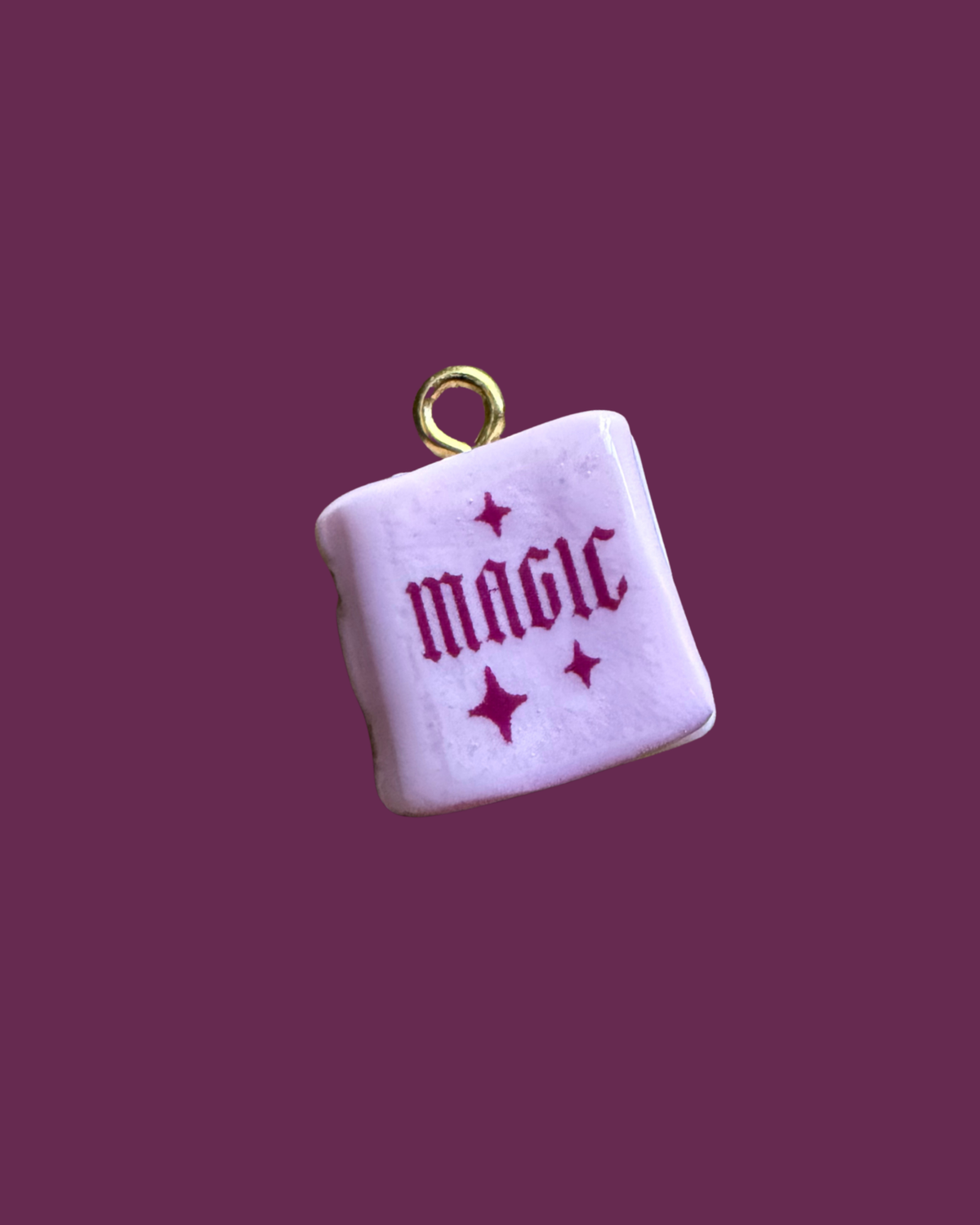 Pink magic book charm