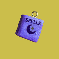 Purple spell book charm
