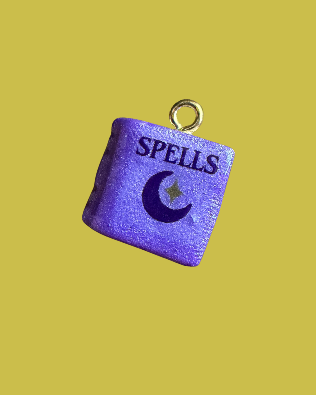 Purple spell book charm